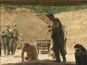 Unlucky prisoner gets punished by the sergeant.