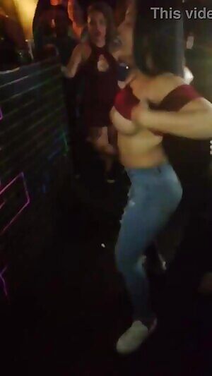 Flashing fake boobs at a club
