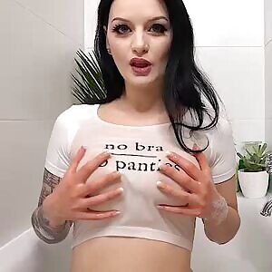 Hot brunette masturbates while taking a bath