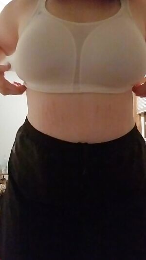 Stripping off a sports bra