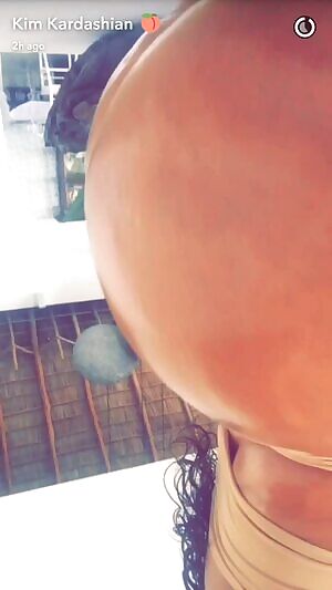 Kim Kardashian Showing Off Her Oiled Ass
