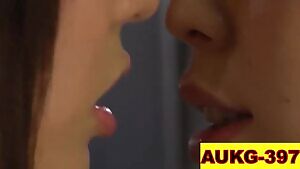 Couple of women softly tongue kiss