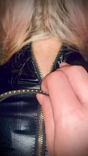 Slowly pulling the zipper down