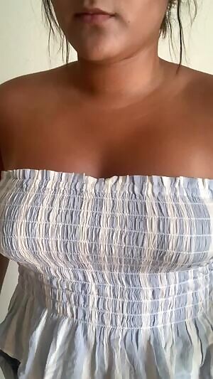 Young Latina playing with tits