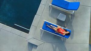 Gianna Dior struts her long legs and presses her perky tits together in a sexy red bathing suit